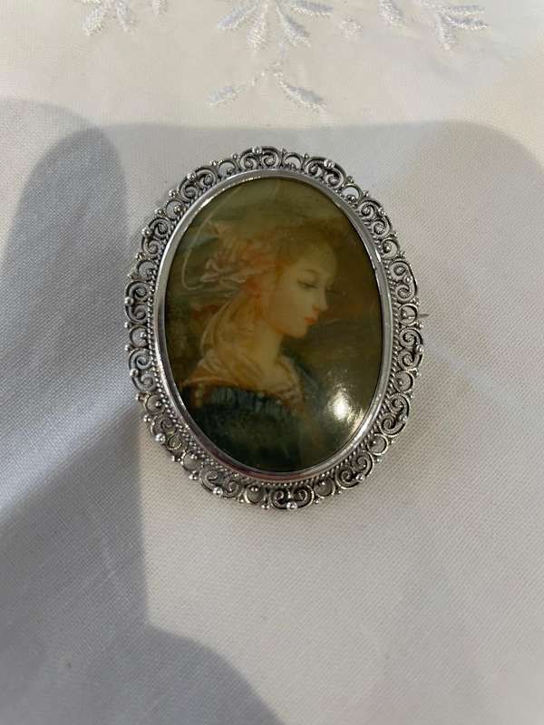 Delicate as a rose petal! Hand painted young lady set in solid silver (800) frame/ornate scrolling!!