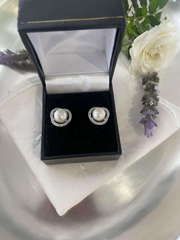 Dramatic gorgeously enhanced cultured freshwater pearls set in elegant 925 sterling silver.