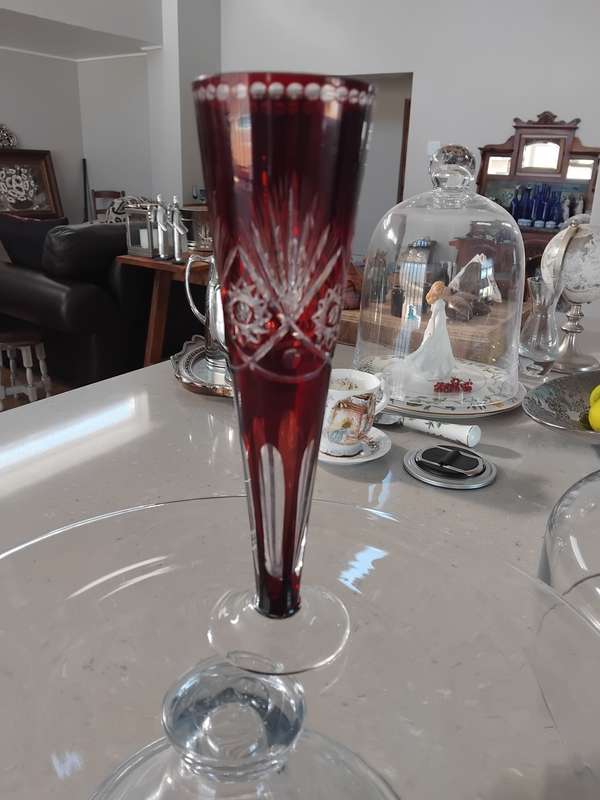 Vintage crystal cut red flash glass trumpet vase with Hobstar design.