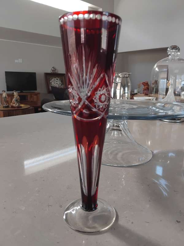 Vintage crystal cut red flash glass trumpet vase with Hobstar design.