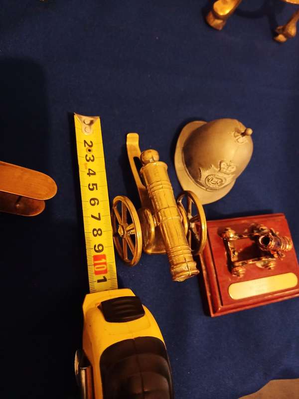 Vintage Brass Cannon Brass Aeroplane. A Cannon and Helmet