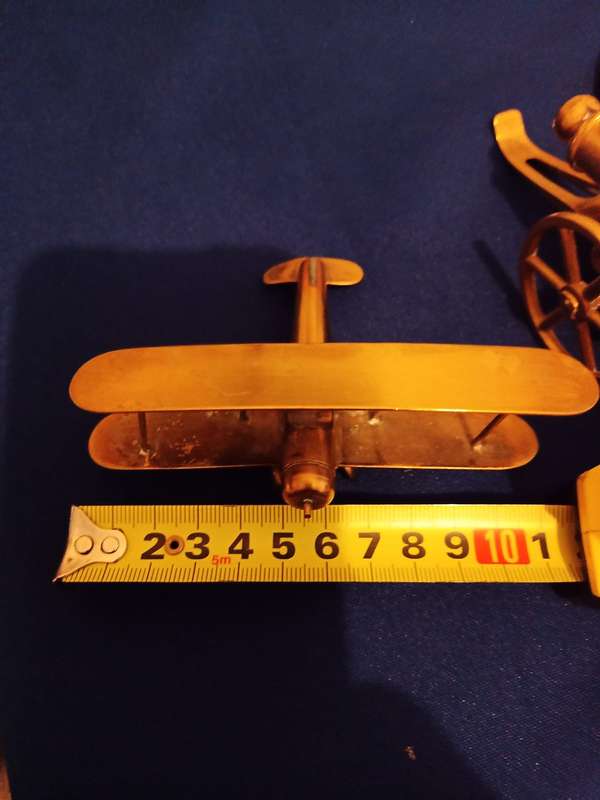 Vintage Brass Cannon Brass Aeroplane. A Cannon and Helmet