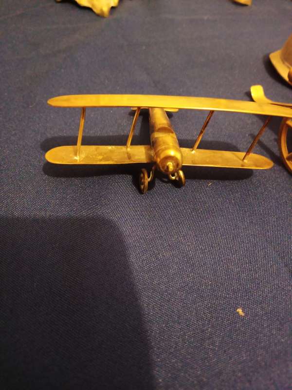 Vintage Brass Cannon Brass Aeroplane. A Cannon and Helmet