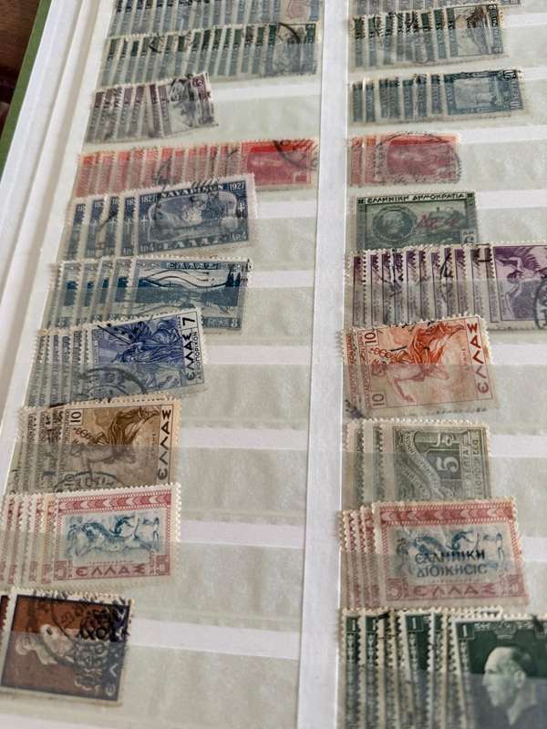 Greek stamps in album