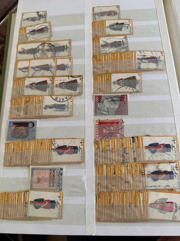 Greek stamps in album