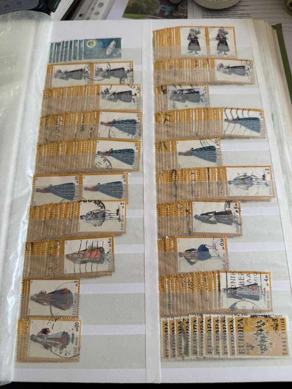 Greek stamps in album