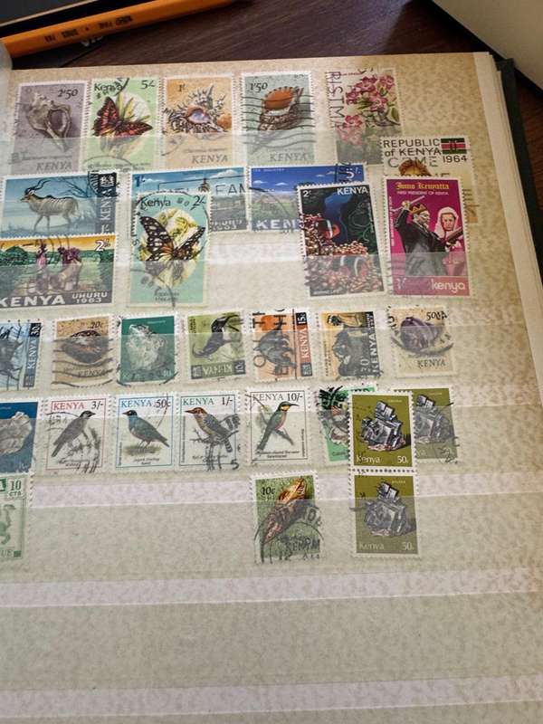 Malaysia,Switzerland ,Morocco, Kenya,Rwanda, Volta,Argentina Stamps in album