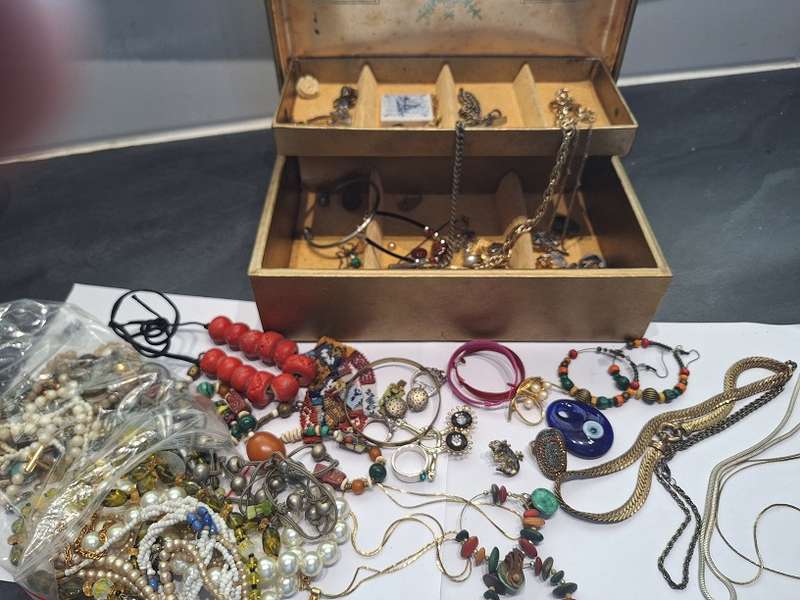 Large jewelry box with various fashion pieces