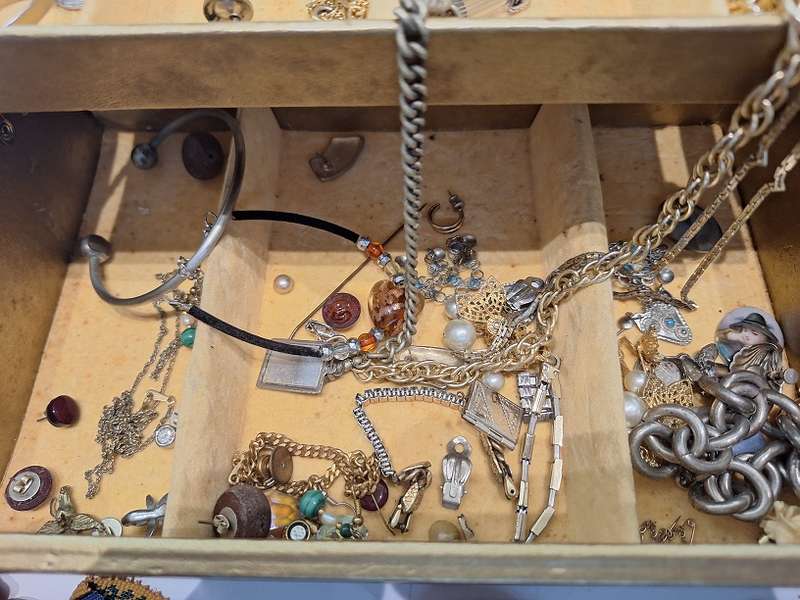 Large jewelry box with various fashion pieces