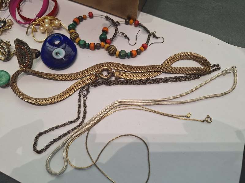 Large jewelry box with various fashion pieces