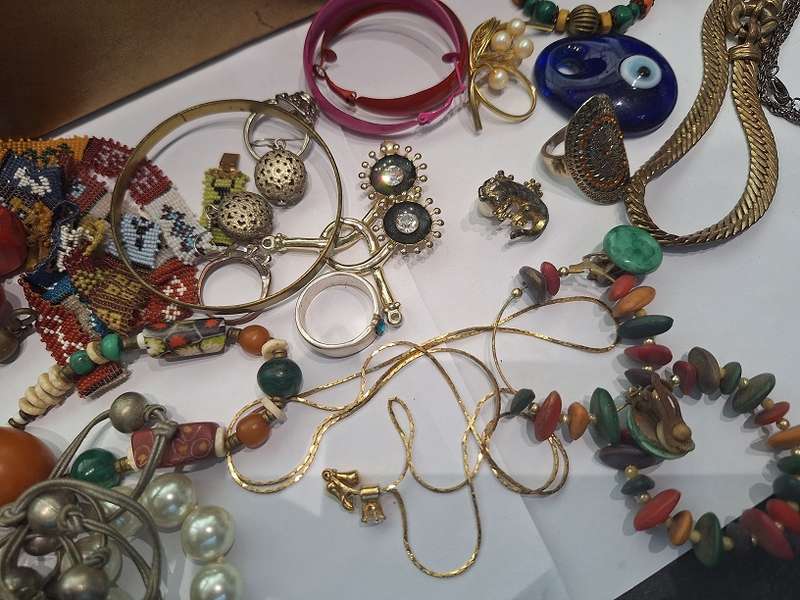 Large jewelry box with various fashion pieces