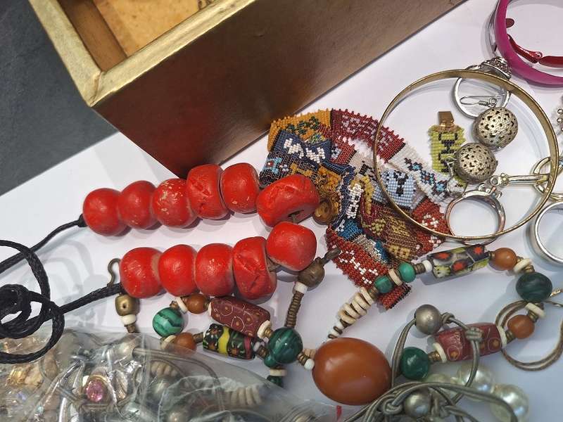 Large jewelry box with various fashion pieces