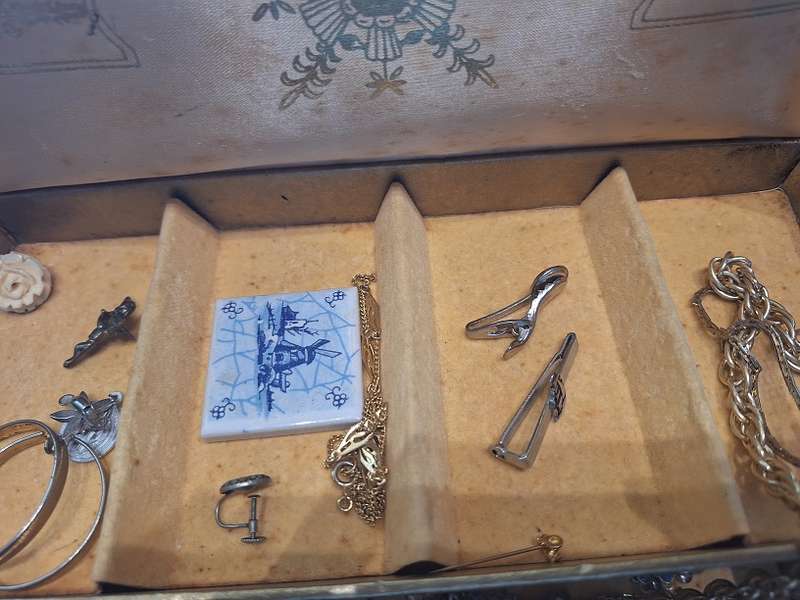 Large jewelry box with various fashion pieces