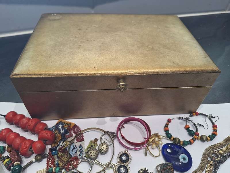 Large jewelry box with various fashion pieces