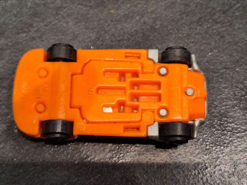 Collection of Hotwheels cars and unmatched train pieces