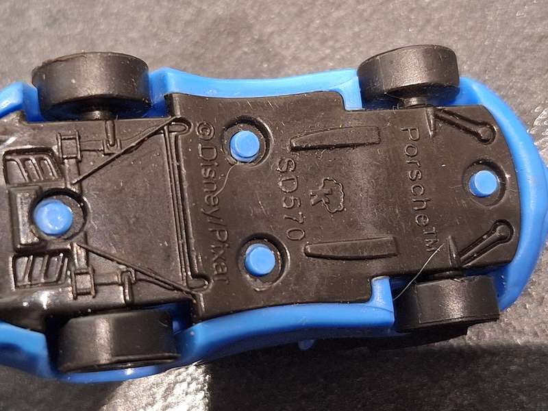 Collection of Hotwheels cars and unmatched train pieces