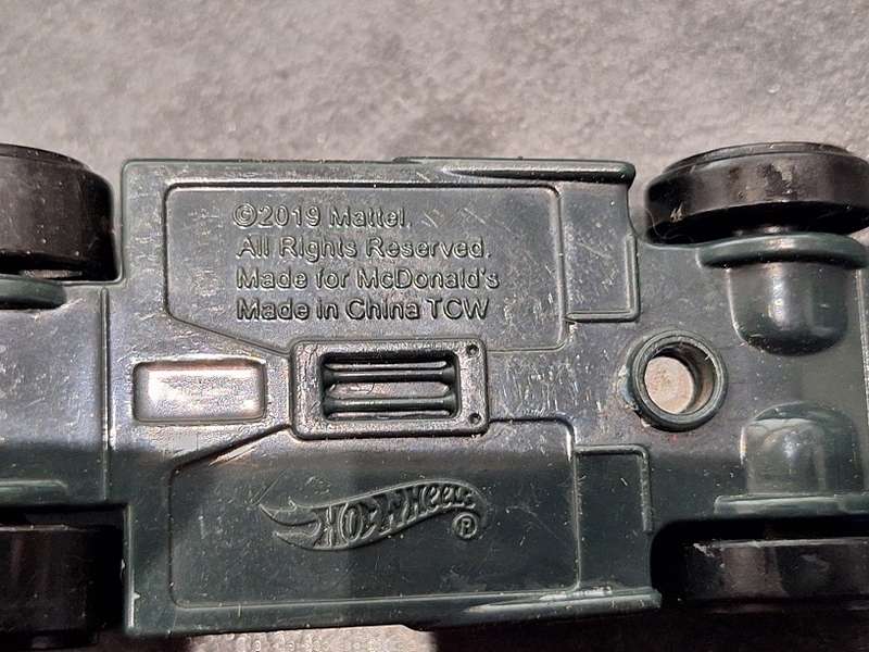 Collection of Hotwheels cars and unmatched train pieces