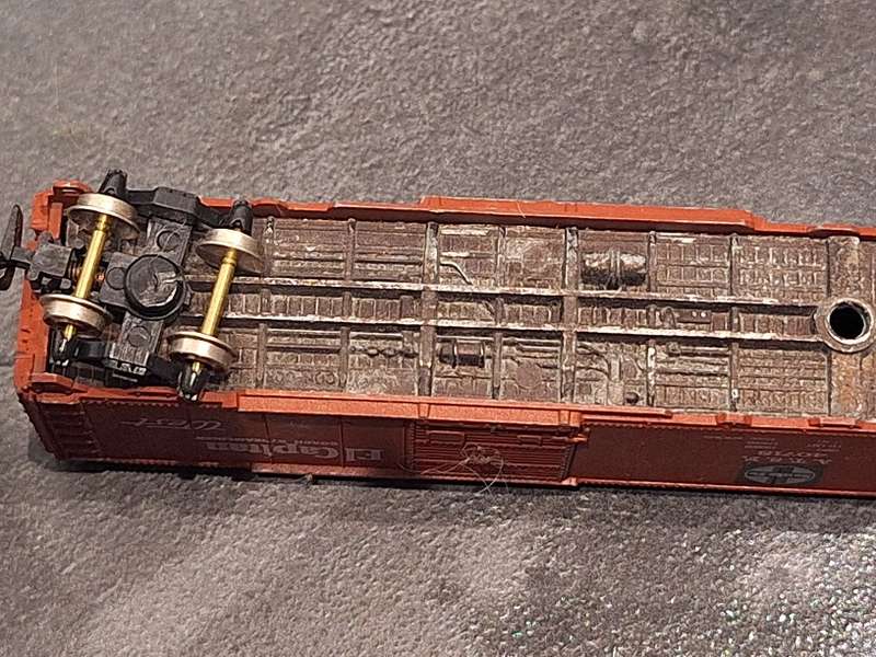 Collection of Hotwheels cars and unmatched train pieces