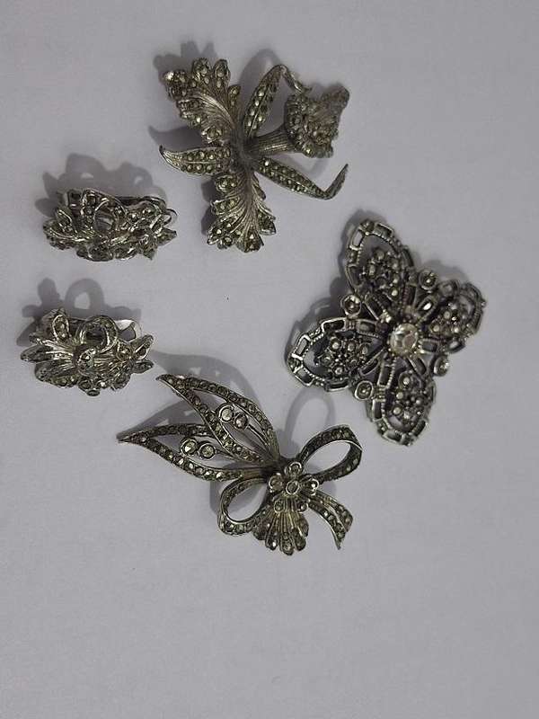 3 x Brooches and 1 pair clip on earrings