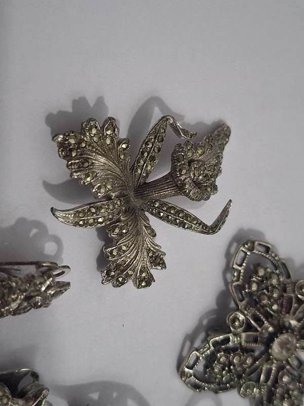 3 x Brooches and 1 pair clip on earrings