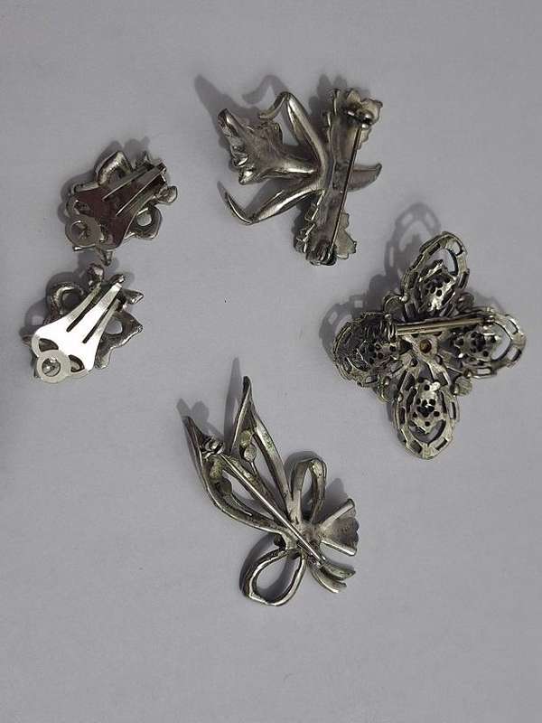 3 x Brooches and 1 pair clip on earrings