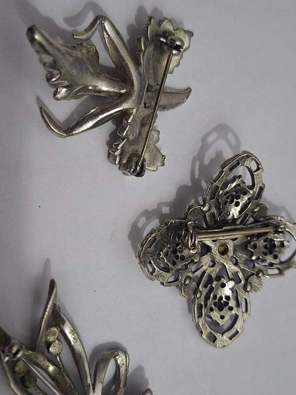 3 x Brooches and 1 pair clip on earrings