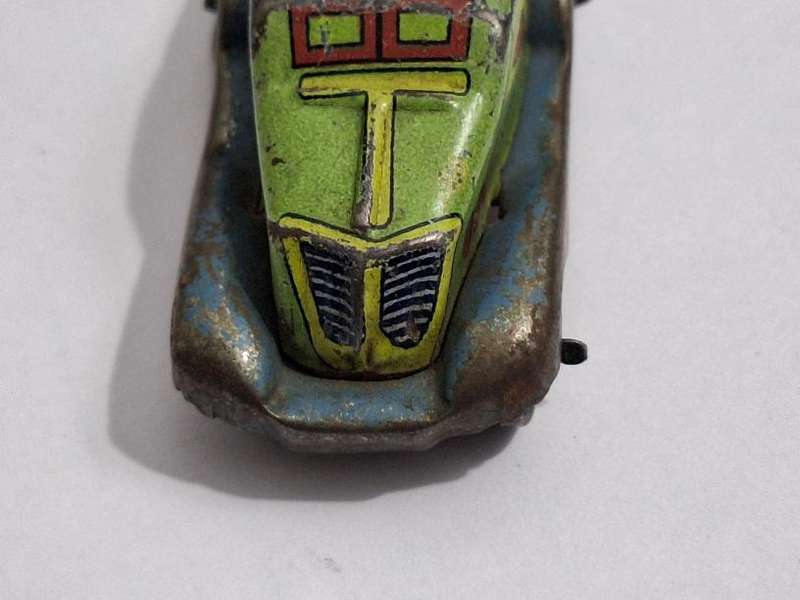 Vintage miniature tin toy car circa 1940s