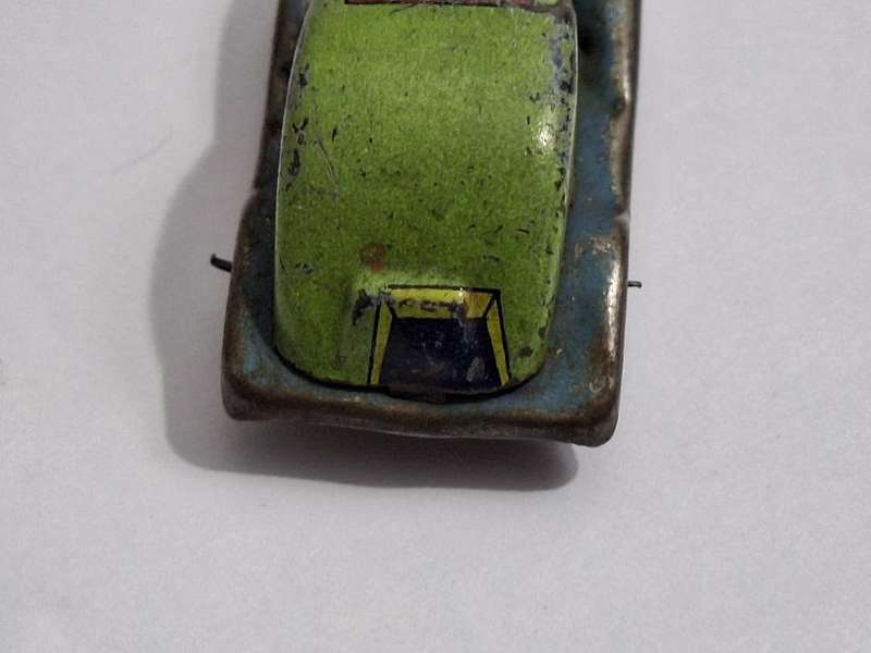 Vintage miniature tin toy car circa 1940s