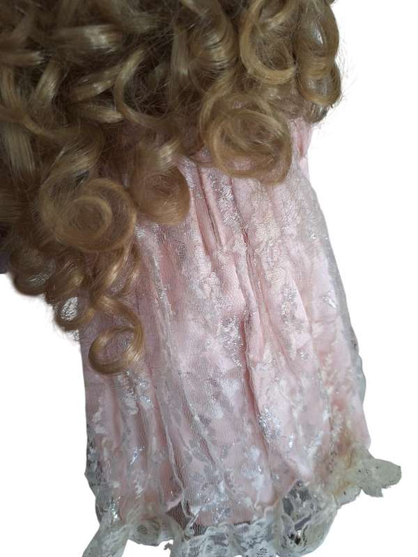 Stunning vintage porcelain doll to add to your collection with stand