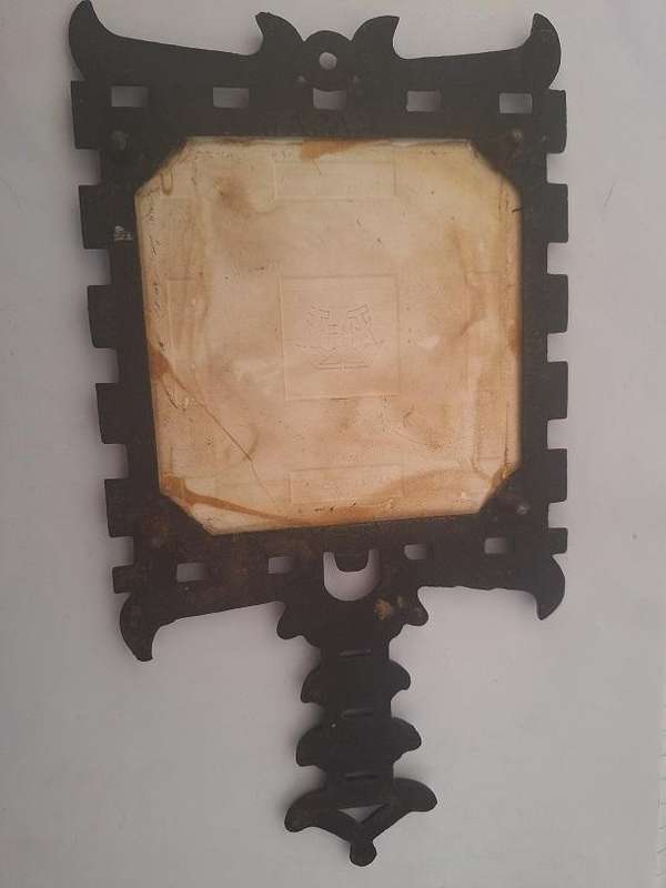 Vintage cast iron trivet with tile