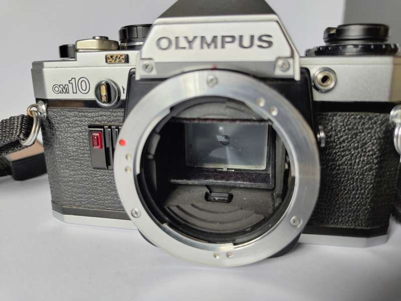 Olympus OM10 and Olympus T32 Flash with accessories