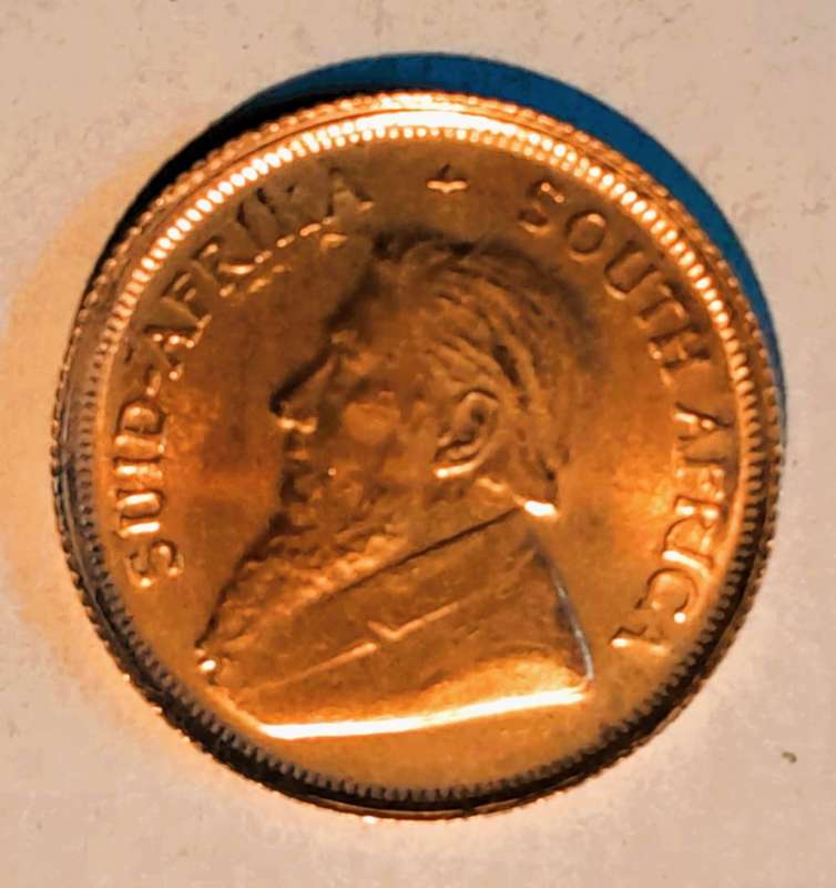 1997 ONE TENTH OUNCE GOLD KRUGERRAND, IN RED SAM BOX with SLEEVE.