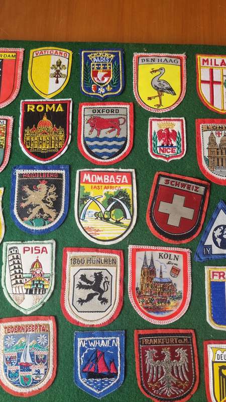 43 x Cloth Souvenir Badges in Excellent Condition neatly sewn patches, onto felt. Mombasa, Europe.