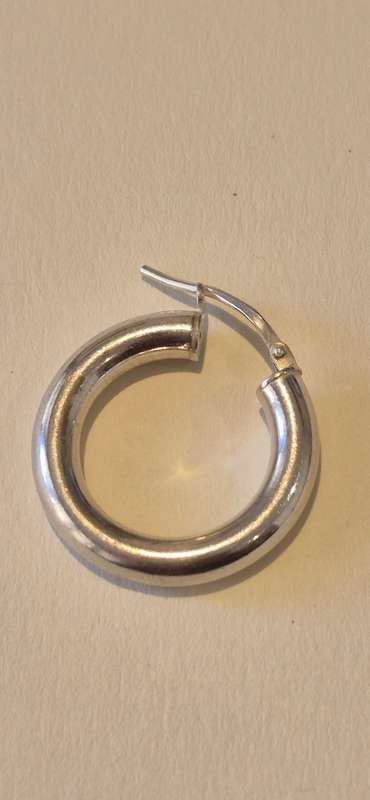 2.2 gram large sterling silver hoop earring. Italy 925 marked.  One tiny dent, otherwise perfect.