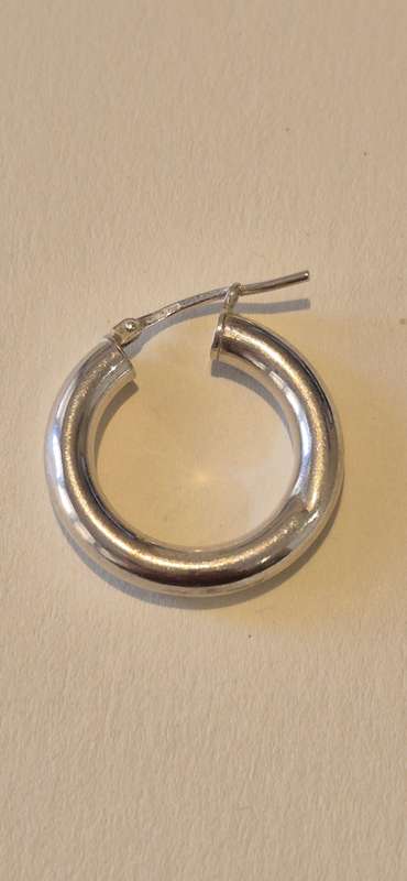 2.2 gram large sterling silver hoop earring. Italy 925 marked.  One tiny dent, otherwise perfect.