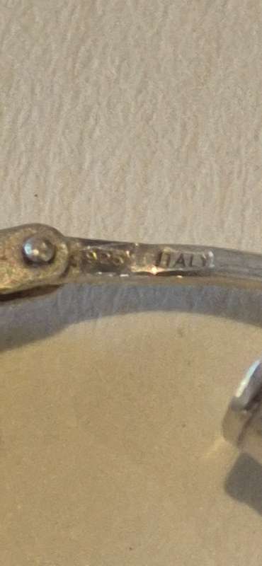 2.2 gram large sterling silver hoop earring. Italy 925 marked.  One tiny dent, otherwise perfect.