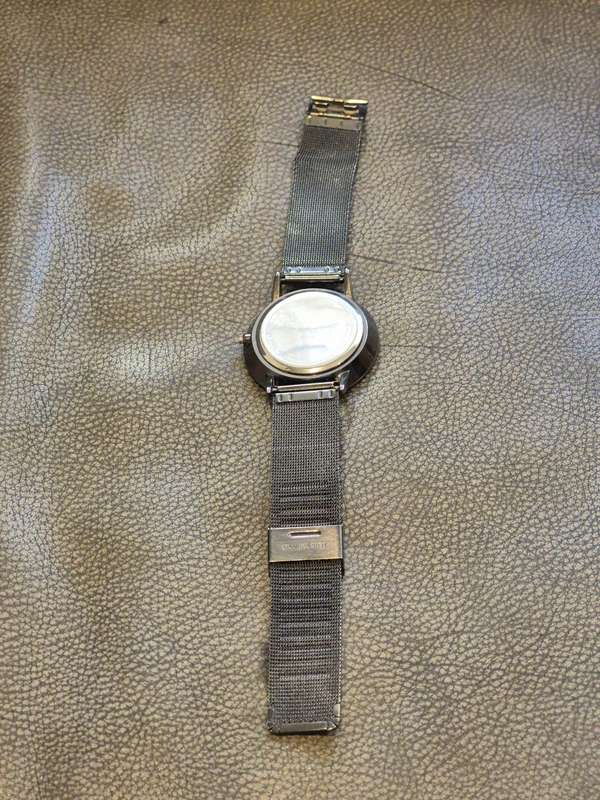 Black All Stainless Steel Mesh Strap, Working, and Black Stainless Steel Watch Case.