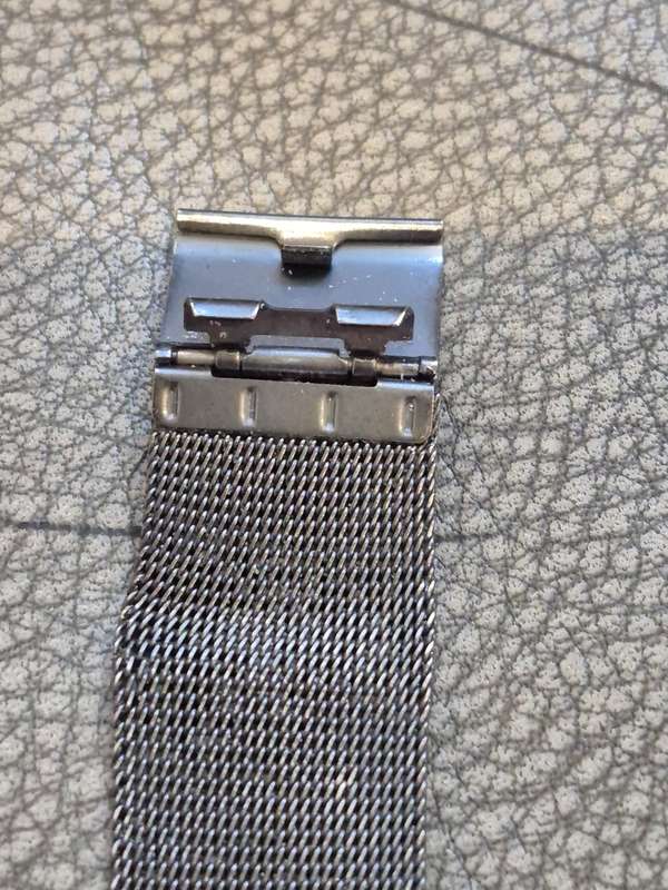 Black All Stainless Steel Mesh Strap, Working, and Black Stainless Steel Watch Case.