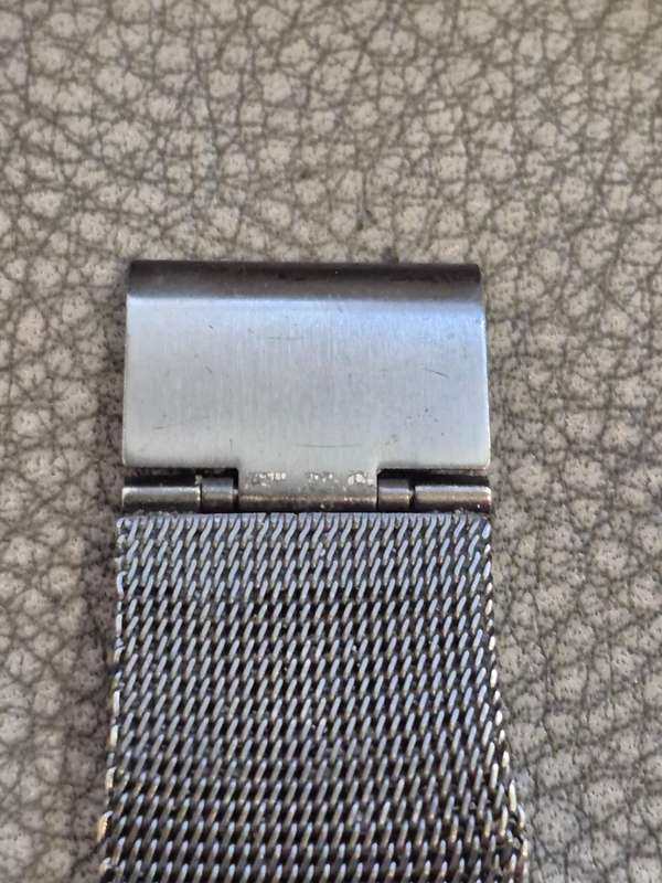 Black All Stainless Steel Mesh Strap, Working, and Black Stainless Steel Watch Case.