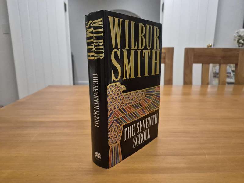 The Seventh Scroll. SIGNED AND INSCRIBED BY WILBUR SMITH TO HIS TRAVEL AGENT FOR HIS EGYPT TRIPS!