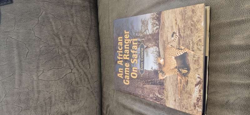 An African Game Ranger on Safari. SIGNED AND INSCRIBED BY AUTHOR. Cowie, Don