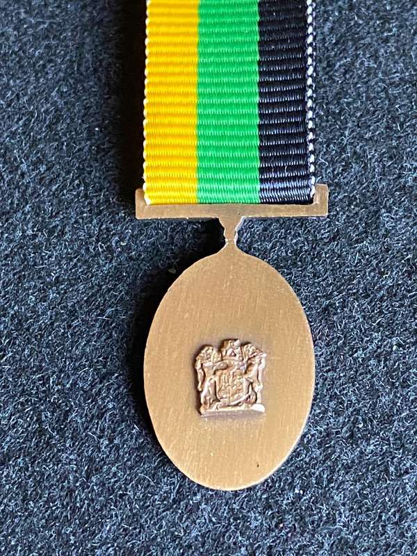 MINIATURE MK 10 YEARS SERVICE MEDAL IN BRONZE