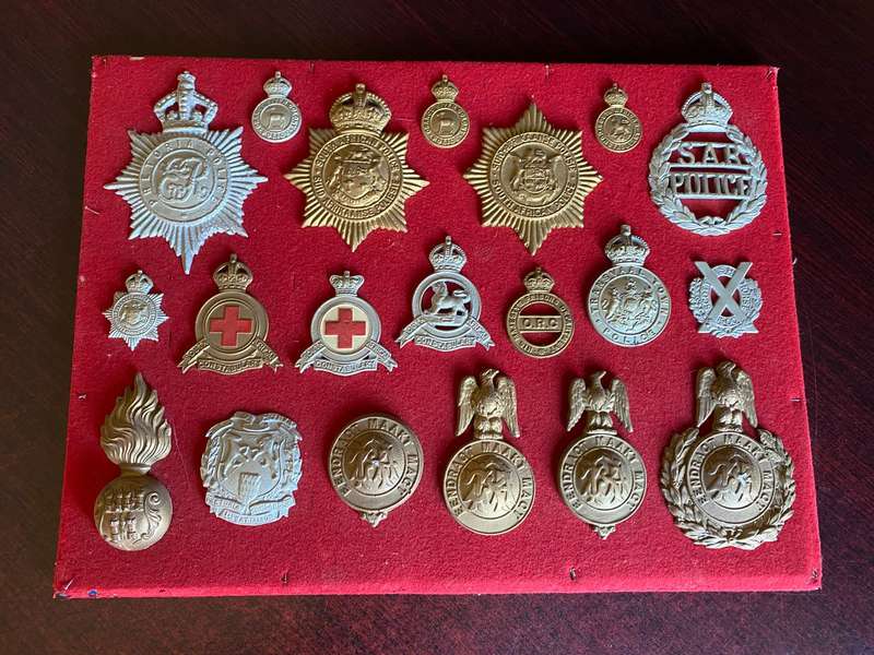 COLLECTION OF 20 CAST (COPY) BADGES