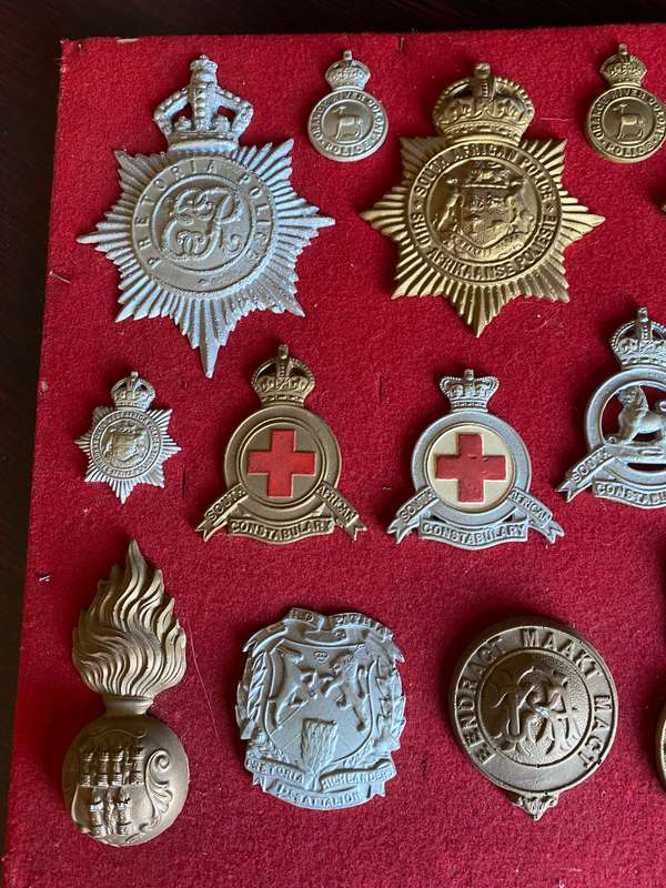 COLLECTION OF 20 CAST (COPY) BADGES