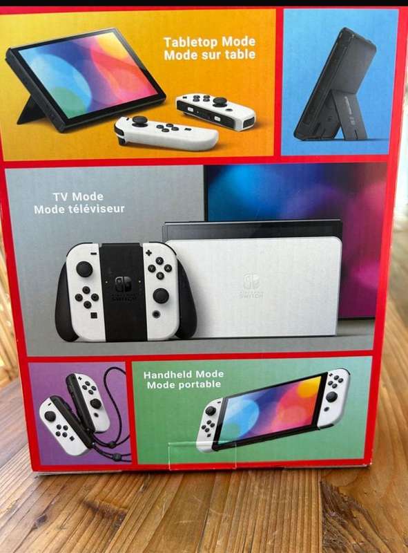 NINTENDO SWITCH-OLED MODEL- IT INCLUDES A 7-INCH VIBRANT OLED SCREEN-A WIDE ADJUSTABLE STAND FOR TAB