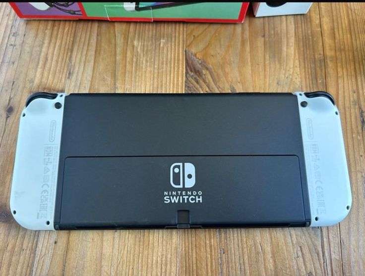 NINTENDO SWITCH-OLED MODEL- IT INCLUDES A 7-INCH VIBRANT OLED SCREEN-A WIDE ADJUSTABLE STAND FOR TAB