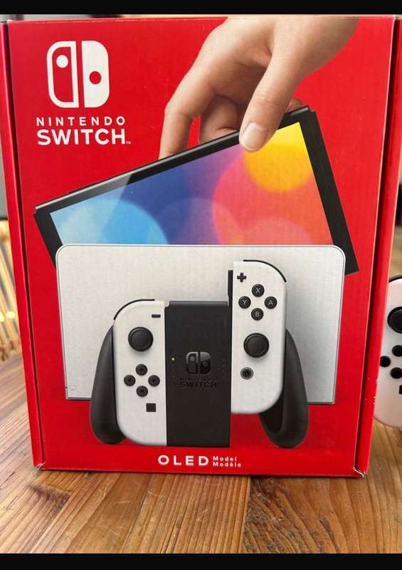 NINTENDO SWITCH-OLED MODEL- IT INCLUDES A 7-INCH VIBRANT OLED SCREEN-A WIDE ADJUSTABLE STAND FOR TAB