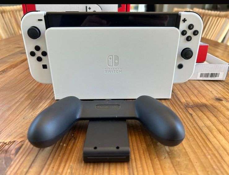 NINTENDO SWITCH-OLED MODEL- IT INCLUDES A 7-INCH VIBRANT OLED SCREEN-A WIDE ADJUSTABLE STAND FOR TAB