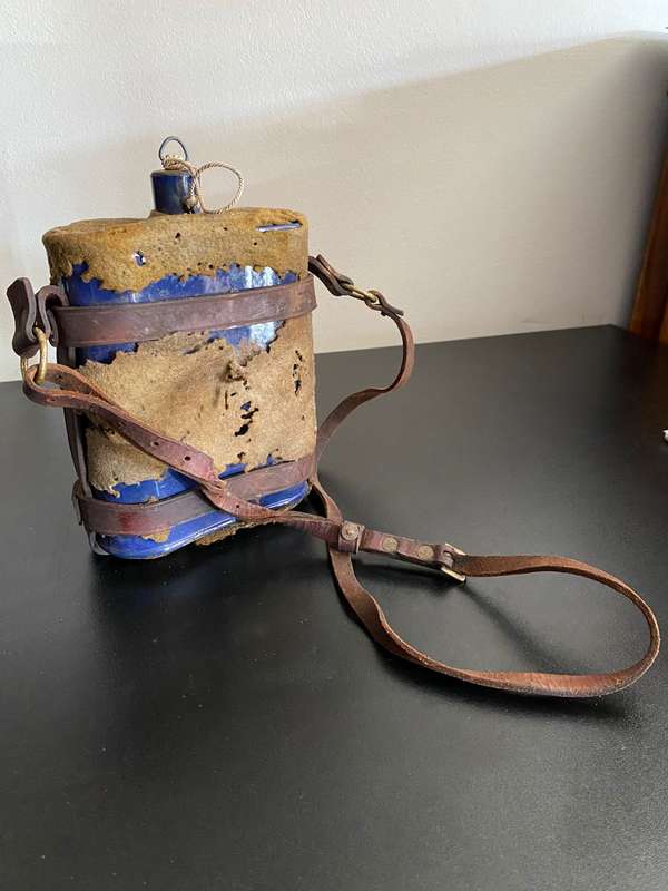 WW1,WATER BOTTLE (BLUE ENAMEL) COMPLETE WITH STOPPER AND LEATHER HARNESS