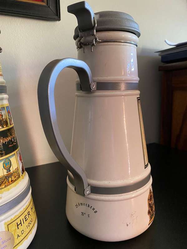 TWO VERY LARGE GERMAN,LIDDED BEER STEINS-PORCELEIN AND STILL SEALED (CONTENTS CANNOT BE GUARANTEED)L